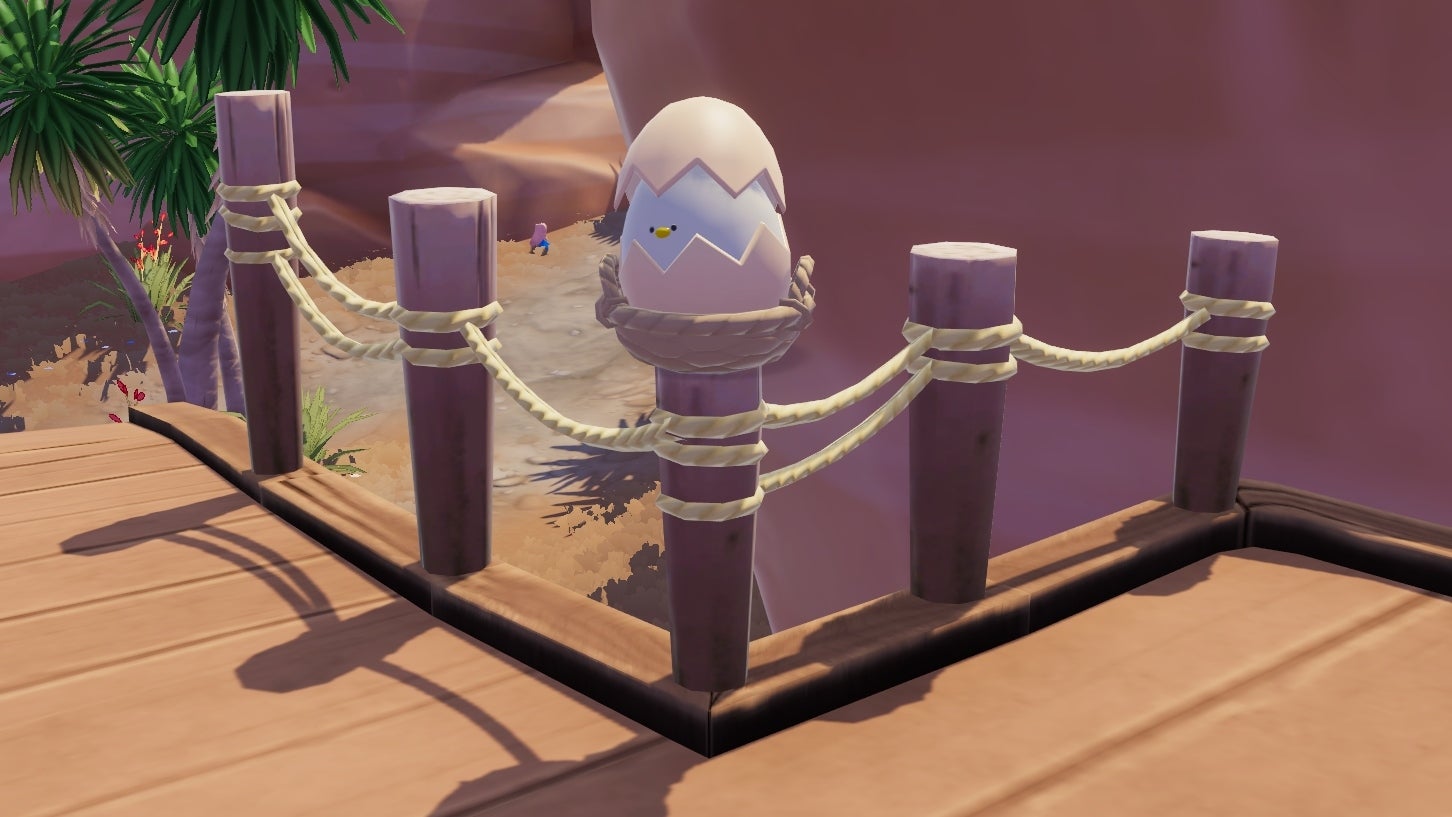 A cracked beige egg with eyes peeking out from the gaps in the shell rests atop a wood-stake rope bridge pillar in Heartopia. - 4
