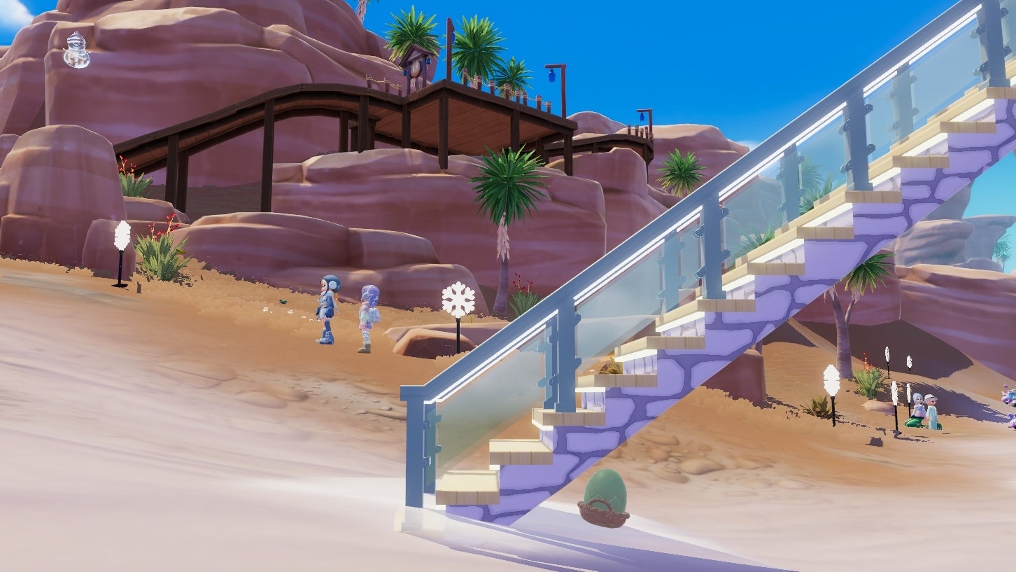 A glass-and-white-stone staircase rises out of view against a backdrop of the desert biome in Heartopia. A green egg is tucked away under the stairs. - 6