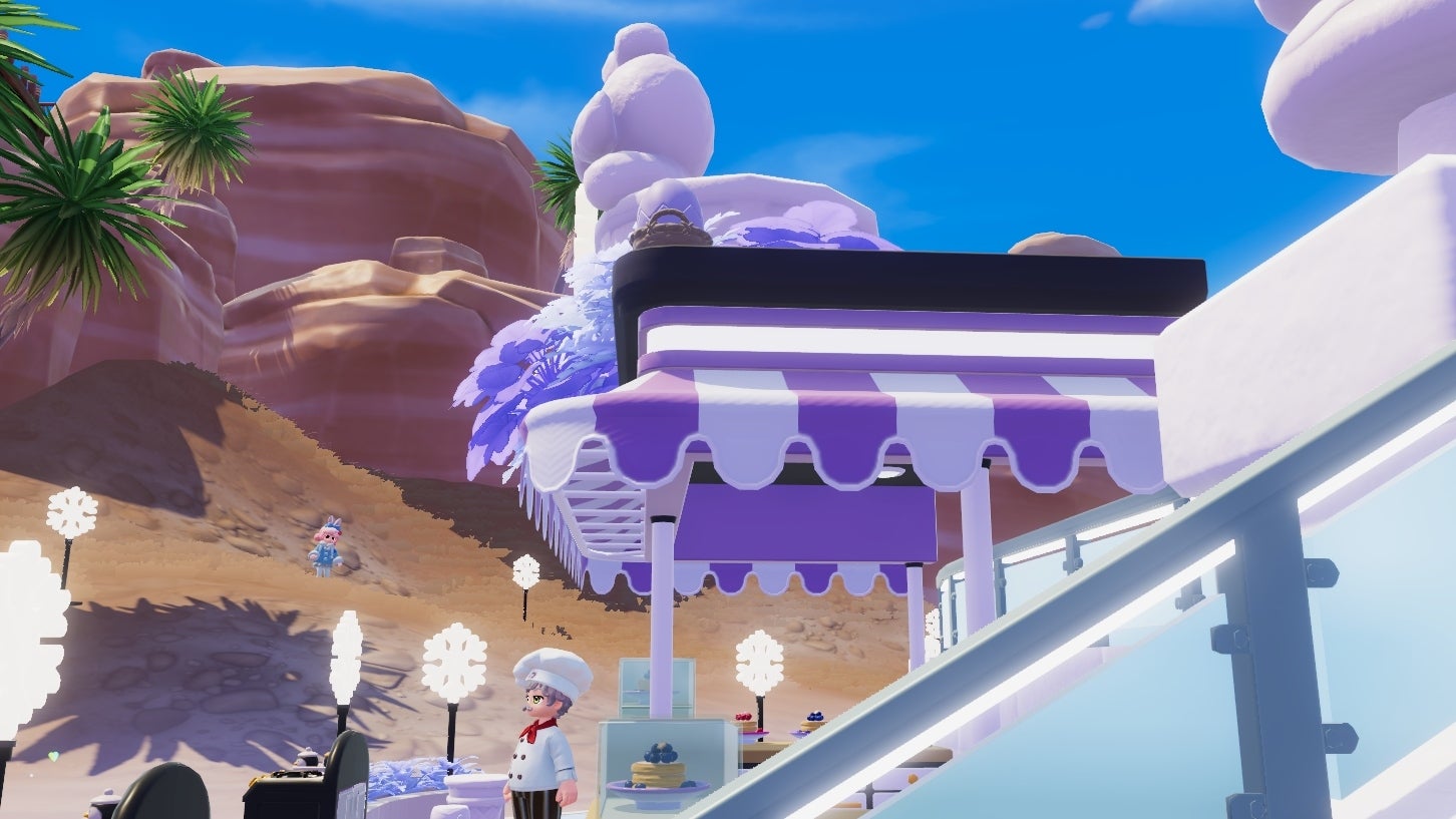 A purple-and-white striped awning strewn with purple flowers sits atop an outdoor kitchen area in Heartopia. Red mountains form the backdrop in contrast to the snow-themed decor of the restaurant. A lavendar-coloured egg in a brown wicker basket is just visible at the awning's edge. - 8