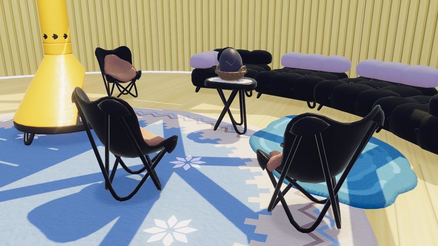 A modern minimalist seating area in Heartopia features black camping chairs and black modular sofas next to a yellow pot-bellied stove. The walls and floors are yellow, offset by blue rugs. A black egg sits in a basket on the table at the centre of the arrangement. - 10
