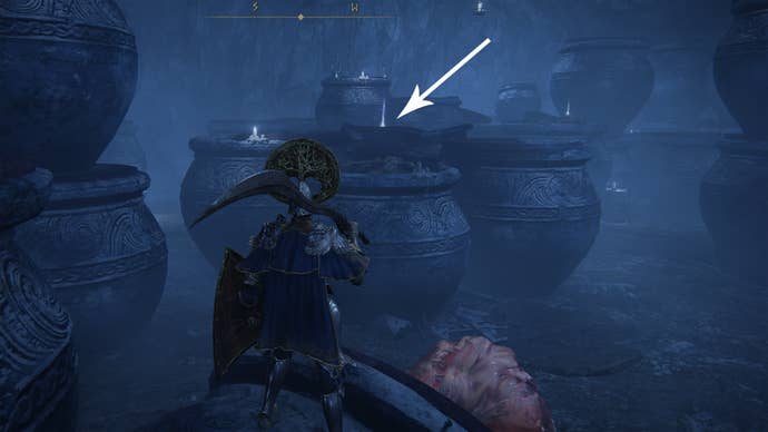 An item lying on some pots in the Belurat Gaol in Elden Ring Shadow Of The Erdtree.