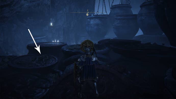 An item lying on some pots in the Belurat Gaol in Elden Ring Shadow Of The Erdtree.