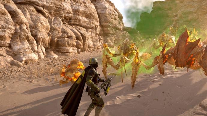 A Helldivers 2 player spraying deadly gas at some terminids.