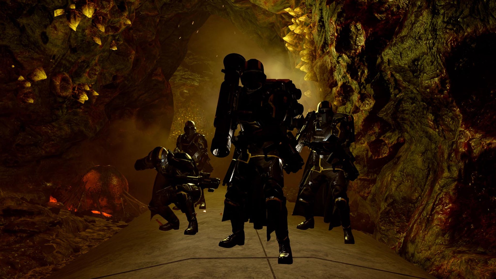 A group of helldivers in a cave in Helldivers 2. - 1