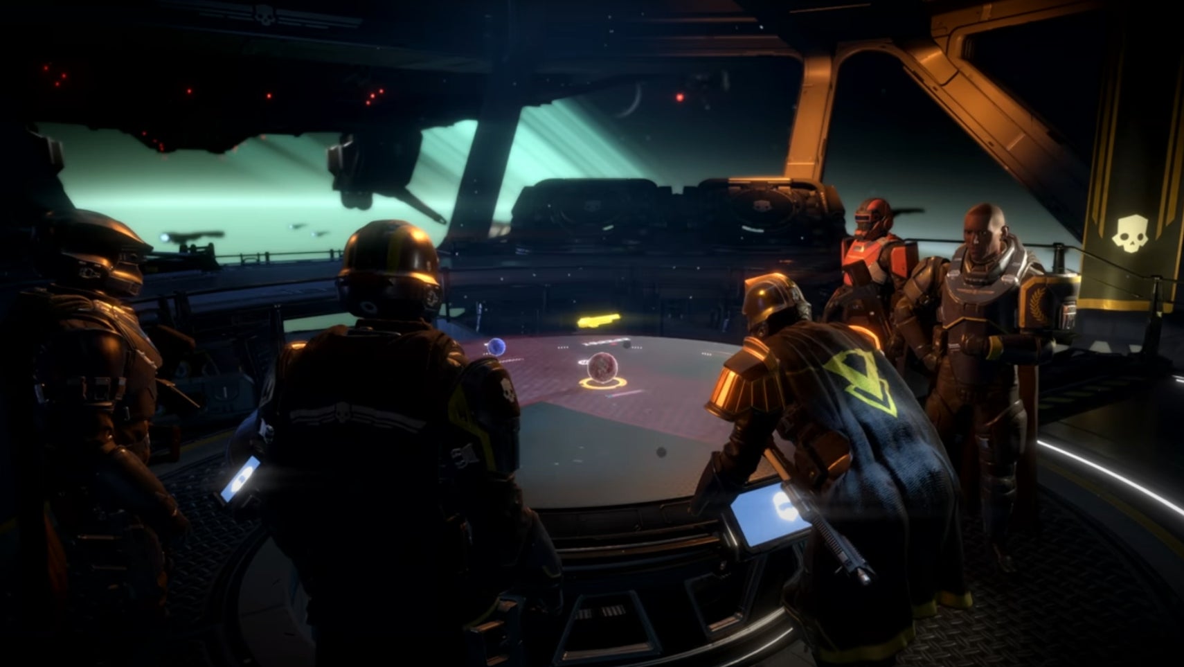 Some helldivers gathered around a console in Helldivers 2. - 1