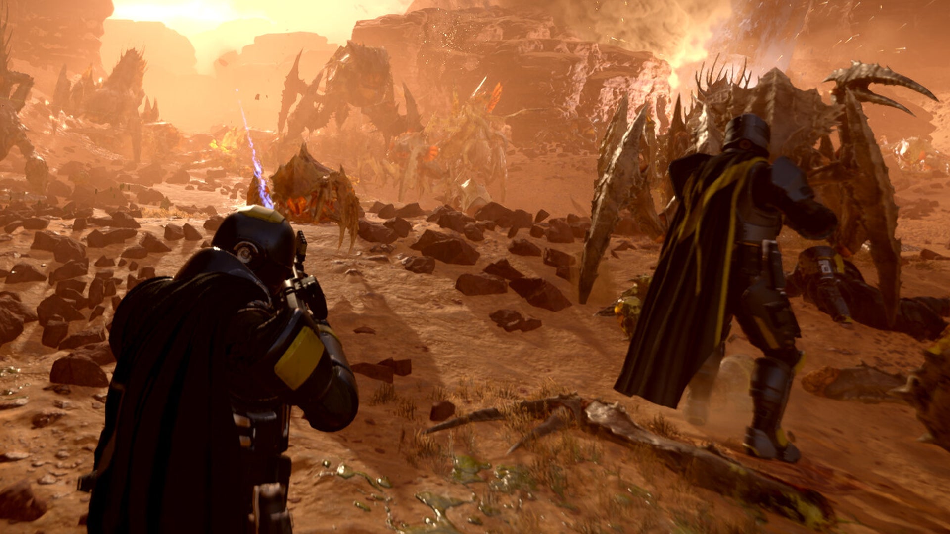 Two Helldivers blast away at approaching alien bugs in Helldivers 2 - 4