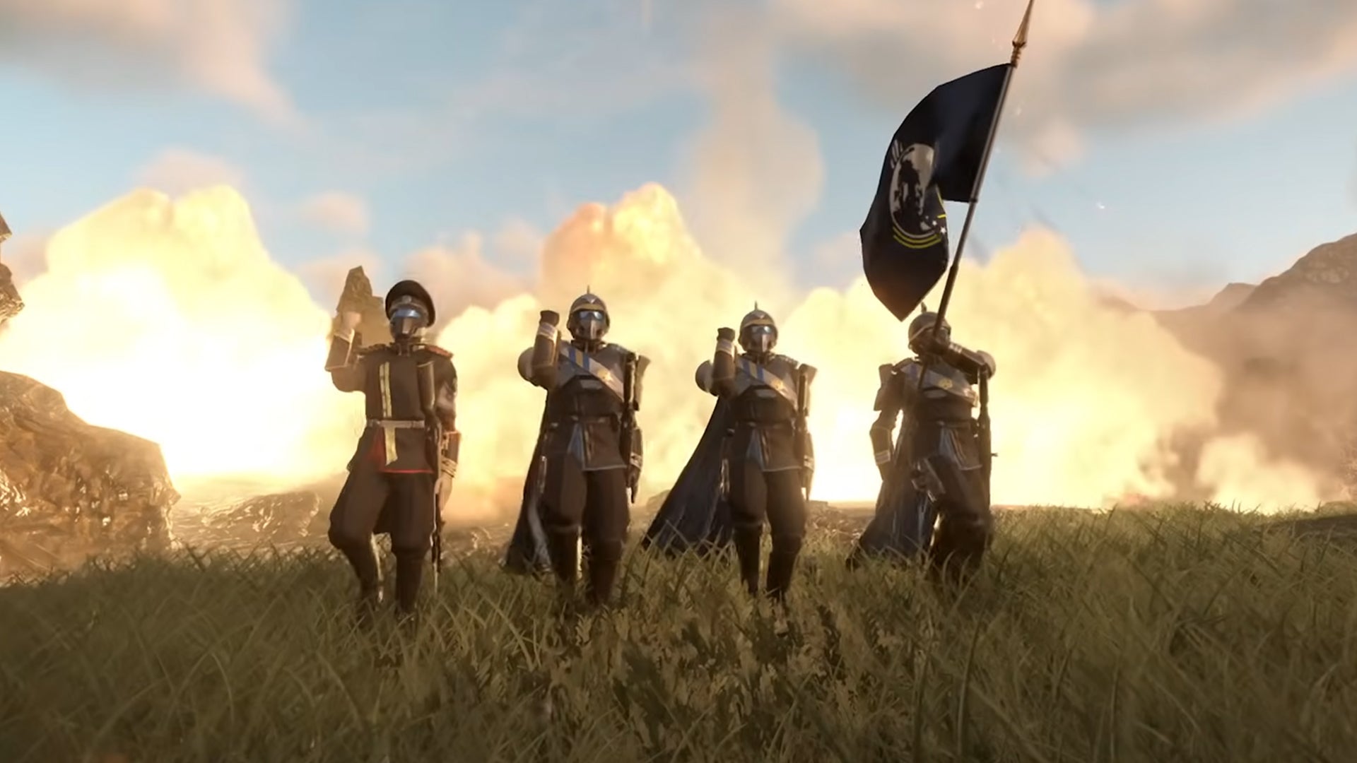 A group of four players in Helldivers 2 marching on the spot, an exlposion going off in the background. - 1