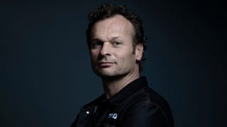 Headshot of PlayStation Studios head Hermen Hulst on dark background