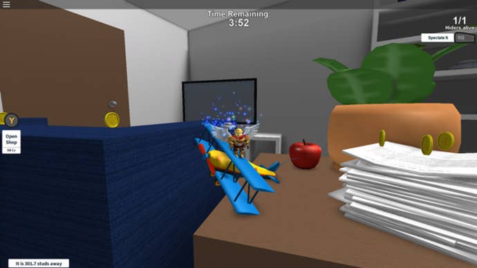 A Roblox character rides a toy airplane around a gigantic living room.