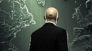 The suited and bald-headed Agent 47, turned away from the camera and looking at a map. The barcode on the back of their head is visible.