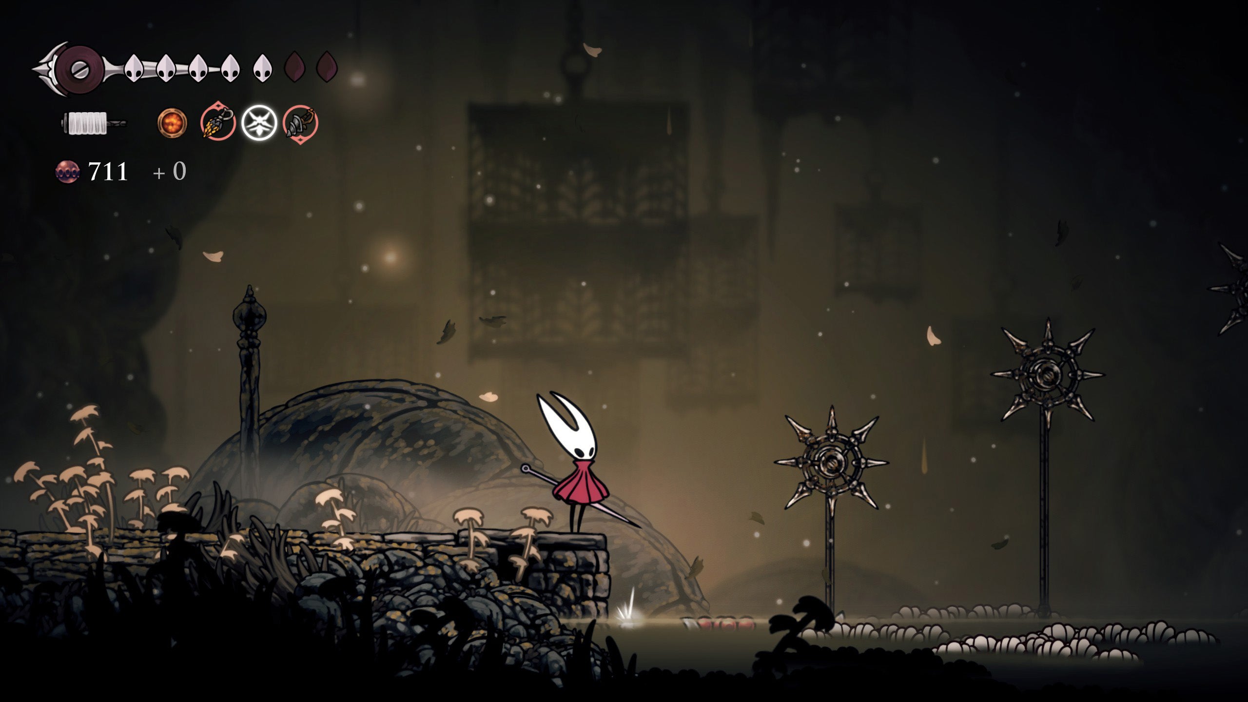 Hornet standing next to spike rings leading to the Sinner's Road bench in Hollow Knight Silksong. - 5
