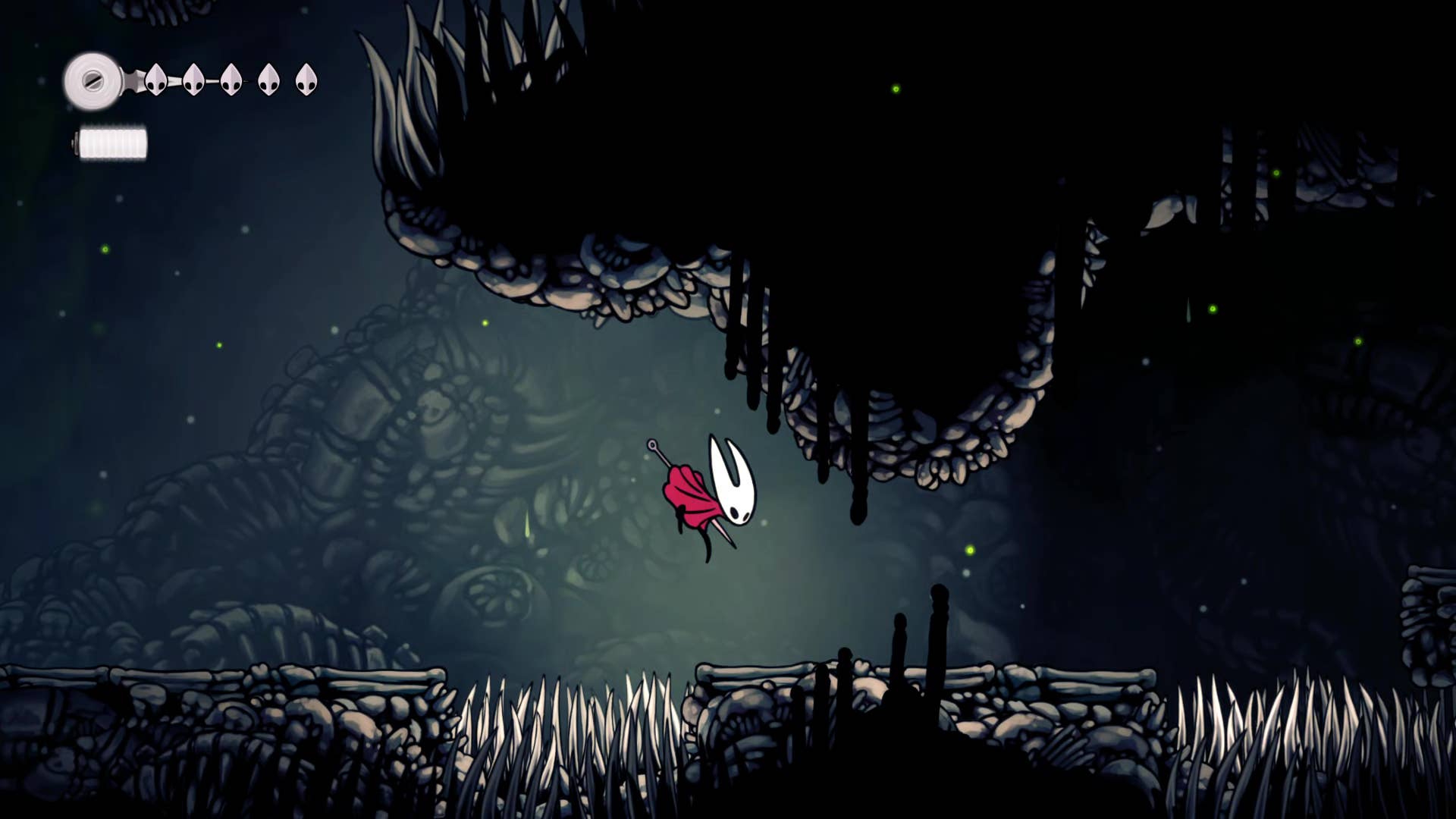 Screenshot of Hollow Knight: Silksong showing the path through the cave of Moss.