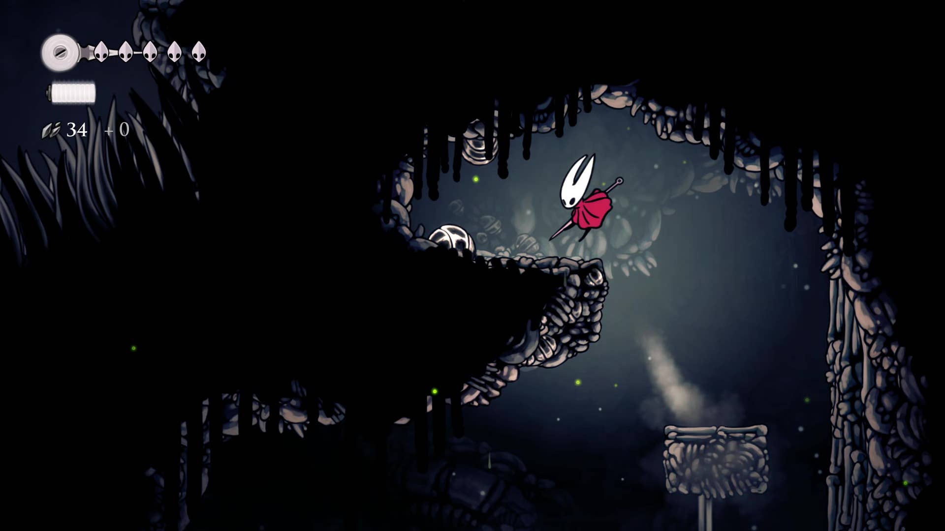 Screenshot of Hollow Knight: Silksong showing the path through the cave of Moss.