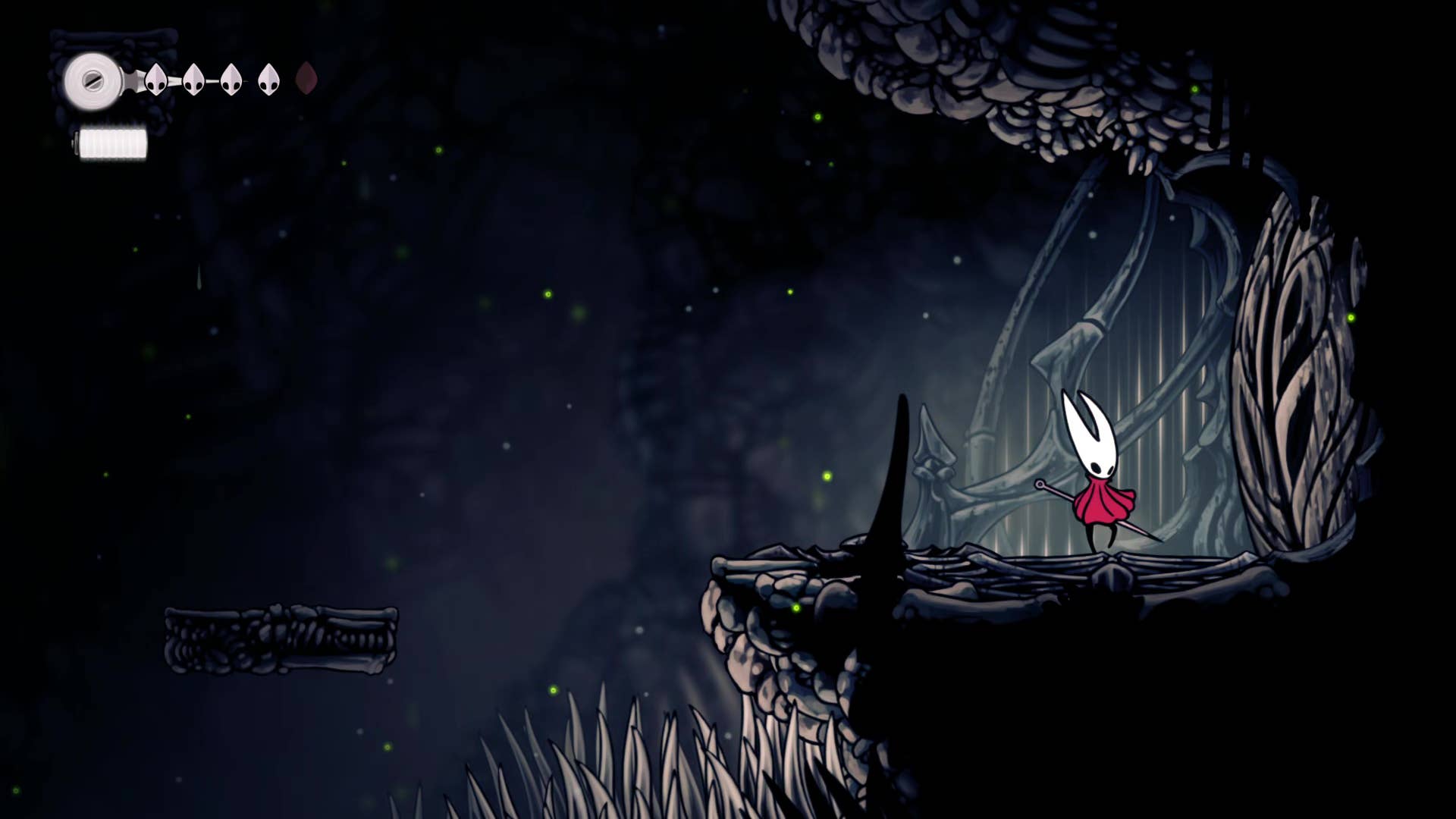 Screenshot of Hollow Knight: Silksong showing the path through the cave of Moss.