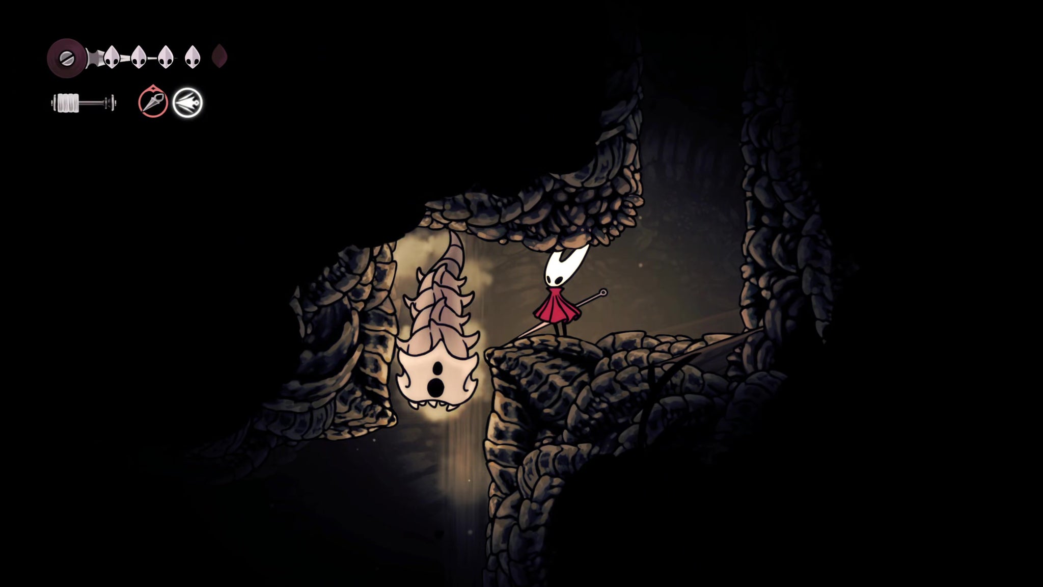 A screenshot of Hollow Knight: Silksong showing the path through to the Chapel Of The Wanderer. - 17