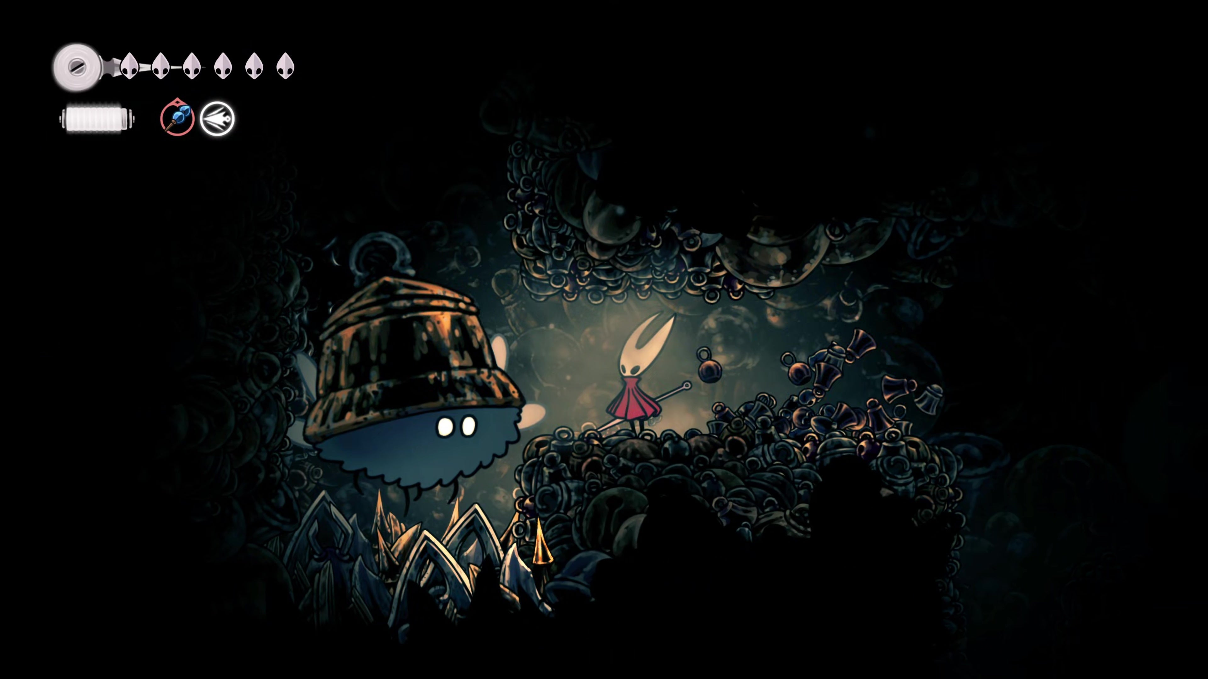 Hornet faces a large, fluffy enemy wearing a bell for a hat in one of the bellveins near Bellhart in Hollow Knight: Silksong. - 6
