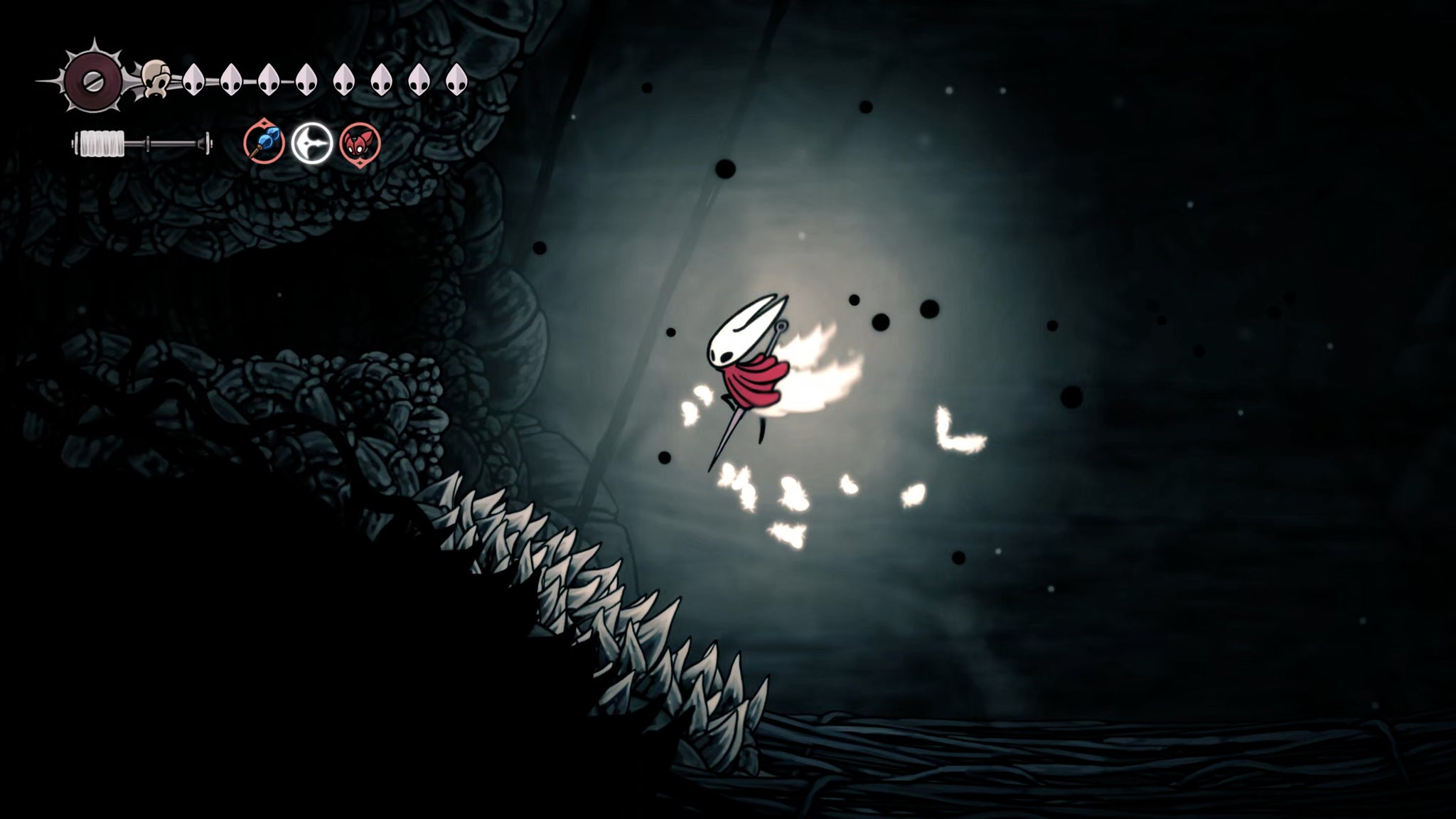 A screenshot of Hollow Knight: Silksong showing the path through The Abyss. - 28
