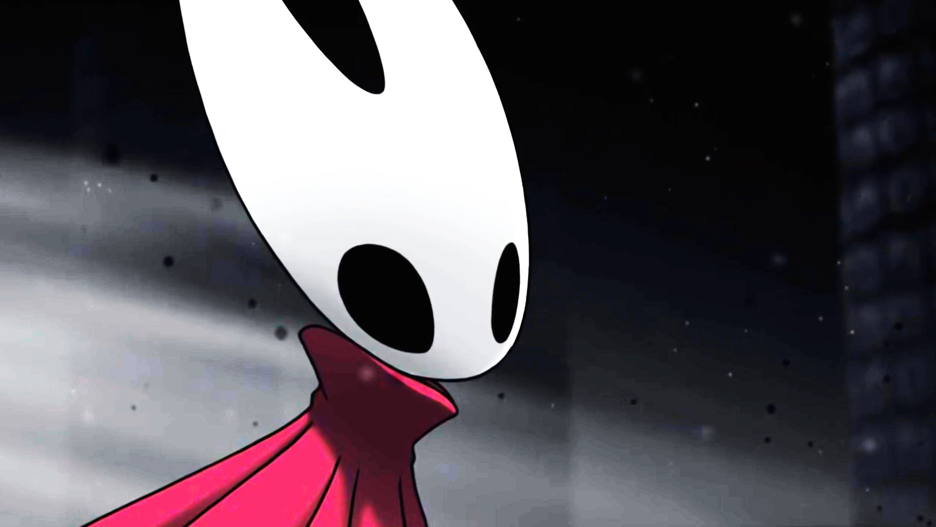 A close-up of Hornet, the protagonist of Hollow Knight: Silksong, at the end of her journey amid the blackness of The Abyss below Pharloom. - 1