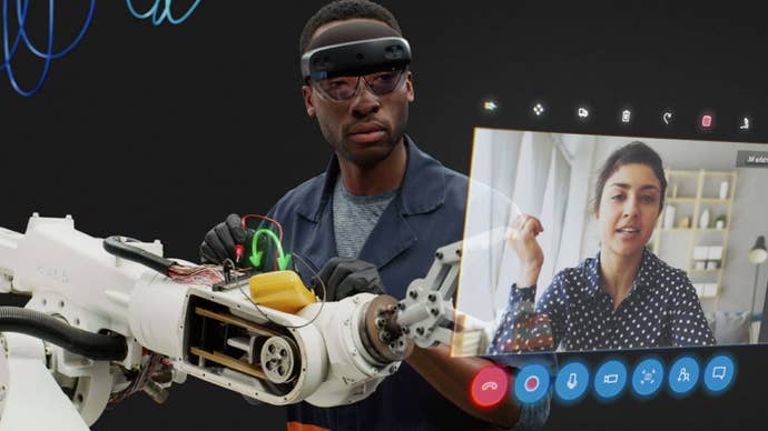 An image showing an engineer working on a robotic arm while wearing a HoloLens headset. He speaks to a colleague on a hovering video feed as if viewed in augmented reality.