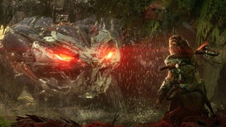 Aloy staring down a giant, robotic turtle with glowing red eyes in Horizon Forbidden West.