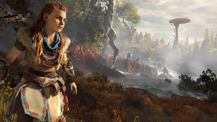Aloy walking near a Tallneck in Horizon Zero Dawn.