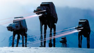 Screenshot of Star Wars Empire Strikes Back showing AT-AT walker vehicles shooting lasers over snowy planet