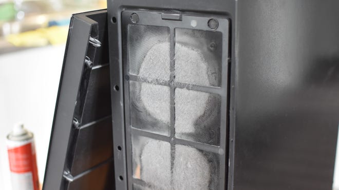 An image of a dirty PC case dust filter.