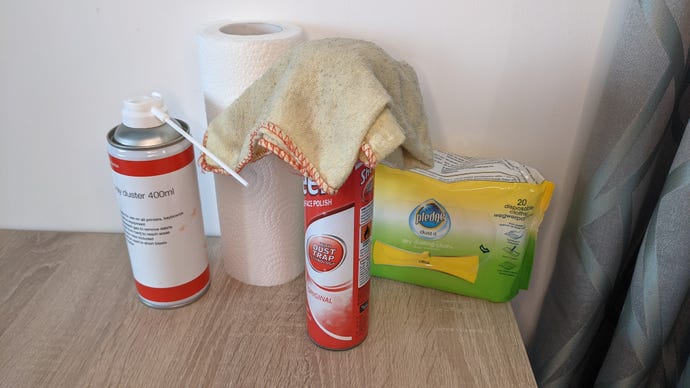An image of PC cleaning equipment, including cloths, polish and a compressed air can.