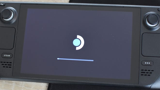 Step 2 of how to set the Steam Deck lock screen: wait for the update to apply and restart.