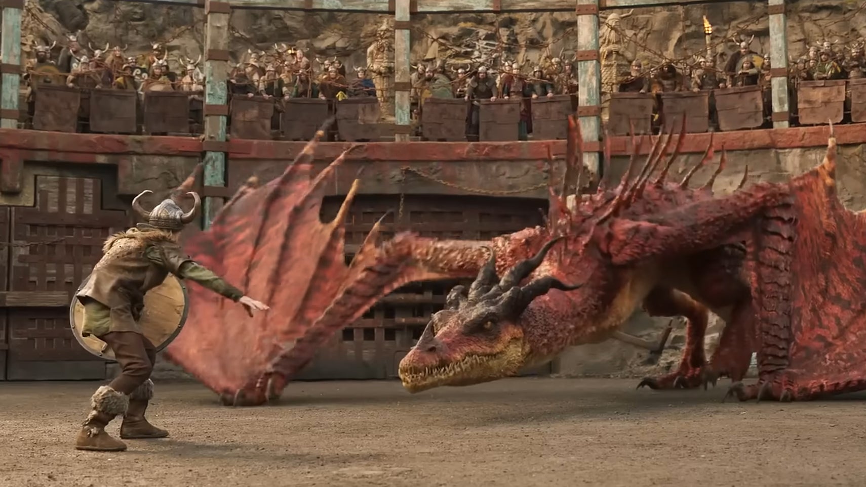 A young viking is facing off against a red dragon in the live-action How To Train Your Dragon remake. - 1