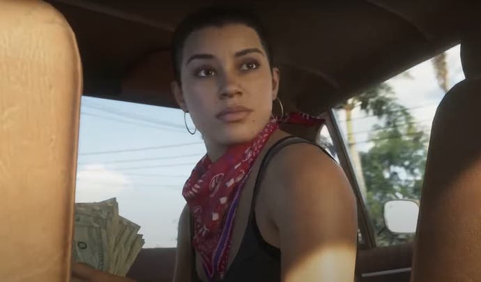 Lucia holds a wad of cash in GTA 6