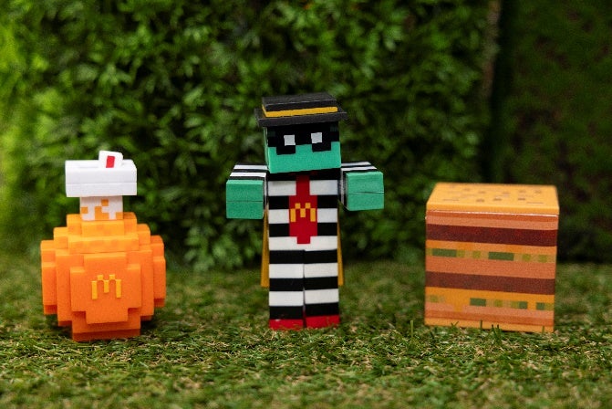 Three collectables from the A Minecraft Movie Meal at McDonald&rsquo;s