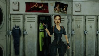 Lara Croft waves, standing in front of a locker with the now-removed pin-up posters behind her.