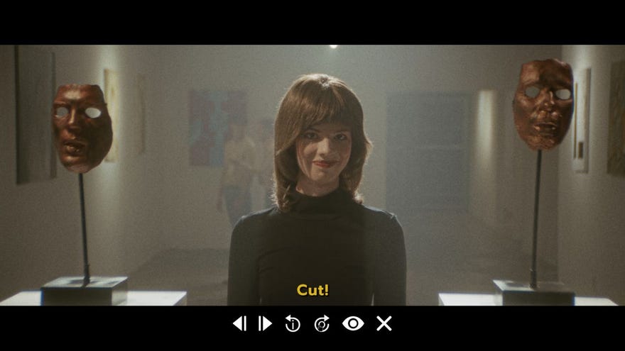 A woman stands in an art gallery between to male masks on plinths, in a clip from Immortality