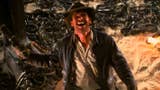 Harrison Ford as Indiana Jones standing amongst a lot of snakes