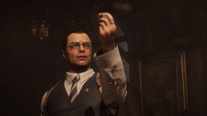 Voss holds a relic up the light.