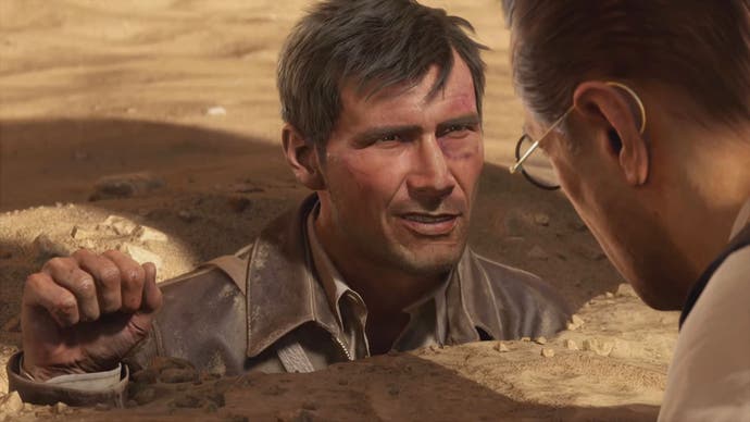 A screenshot from Indiana Jones and the Great Circle showing Indy buried in sand up to his shoulders.
