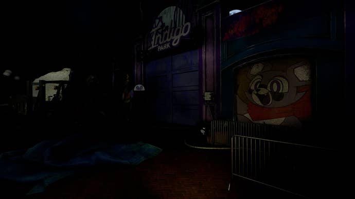 A grim and dark entrance to an abandoned theme park, with a decal of the park’s raccoon mascot visible in the foreground.