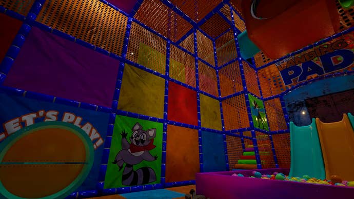 A brightly-coloured soft play area featuring Indigo Park's raccoon mascot, only slightly creepy due to how poorly lit it is.