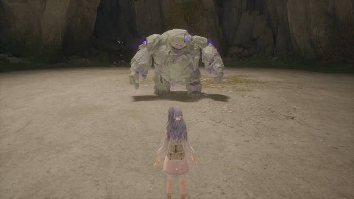 Nikki in Infinity Nikki faces off against a Bouldy enemy in a cave.