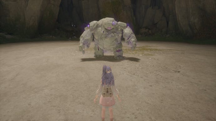 Nikki in Infinity Nikki faces off against a Bouldy enemy in a cave.