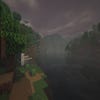 A screenshot of a river in Minecraft, with some trees on either side of the bank and a hill in the distance, taken using Insanity shaders.