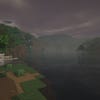 A screenshot of a river in Minecraft, with some trees on either side of the bank and a hill in the distance, taken using Insanity shaders.