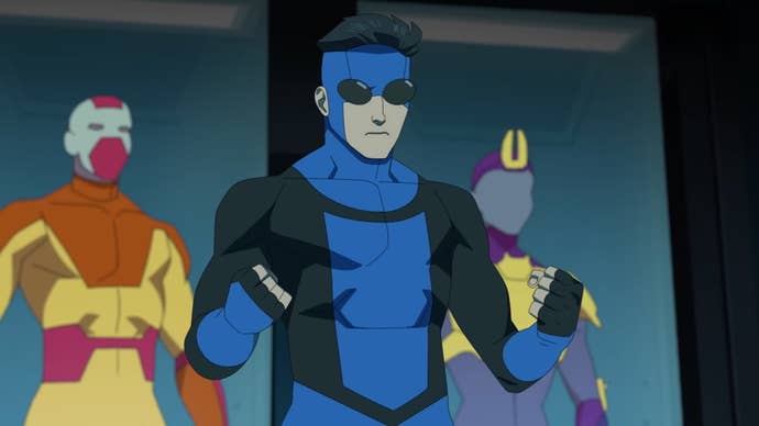 The titular Invincible wearing his black and blue superhero suit for the first time.