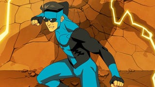 Mark Grayson in his black and blue suit, the wall behind him damaged, a shadow looming over him in a poster for Invincible.