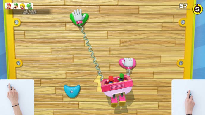 A screenshot of a mouse pointer driven minigame in Mario Party Jamboree TV on Nintendo Switch 2. Players manipulate giant hands with the mouse to climb up a sheer wall.