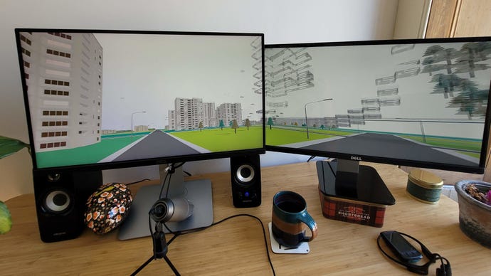 A photo of a screensaver spanning two monitors in The Jean-Paul Software Screen Explosion.