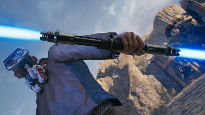 A close-up screenshot of a blue-bladed lightsaber in Cal’s hand in Jedi: Survivor.