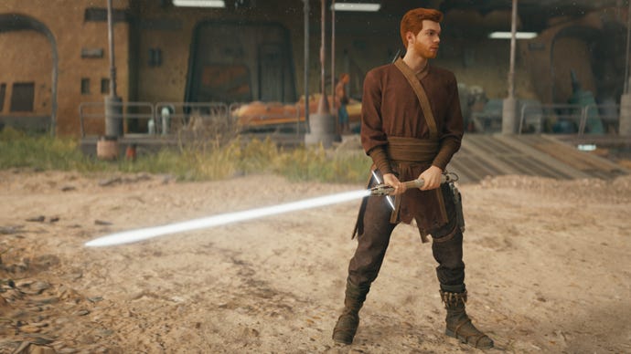 Cal stands outside Pyloon’s Saloon holding a white crossguard lightsaber in Star Wars Jedi: Survivor.