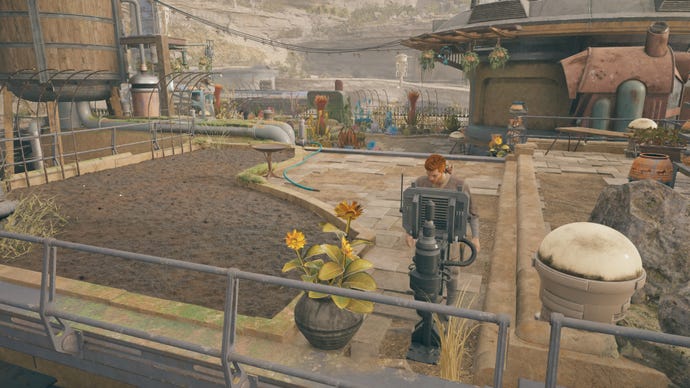 Cal looks at a terminal on the roof of Pyloon’s Saloon in Jedi: Survivor.